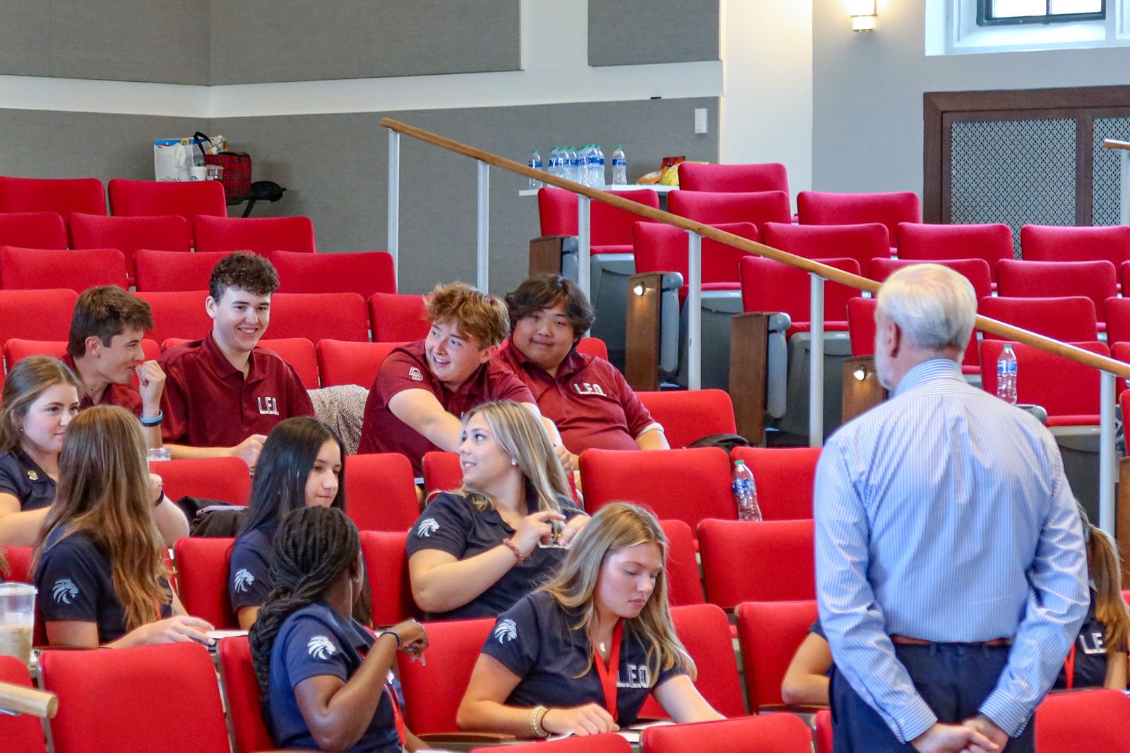 L.E.O. students from Don Bosco Prep and Mount Saint Dominic Academy in a lecture hall with a guest speaker