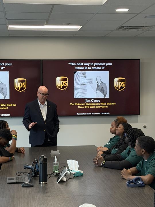 A UPS leader speaking with West Side L.E.O. students